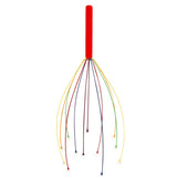 A head massager with a red handle and multiple colorful, flexible wires fanning out, each tipped with a round end. The tone is playful and relaxing.