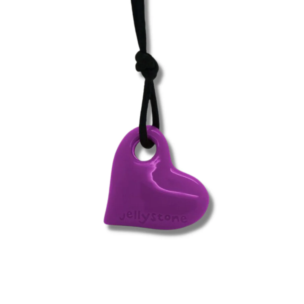 Purple heart-shaped pendant on a black cord, embossed with "Jellystone." The cord is knotted above the pendant, set against a plain white background.