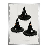 Meri Meri black honeycomb witch hat decorations packaging featuring three star-studded hats.