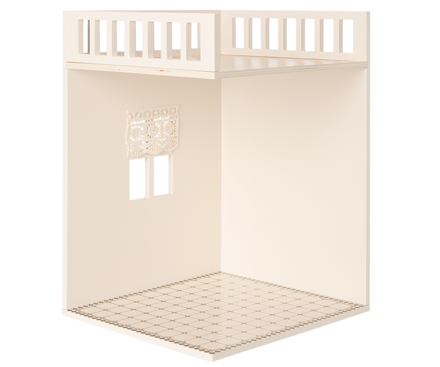 A minimalist dollhouse bathroom with two small windows and curtains, featuring a decorated tiled floor.