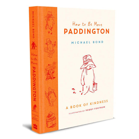 Book cover of "How to Be More Paddington" by Michael Bond. Features an illustration of Paddington Bear with a hat and suitcase, conveying warmth and kindness.