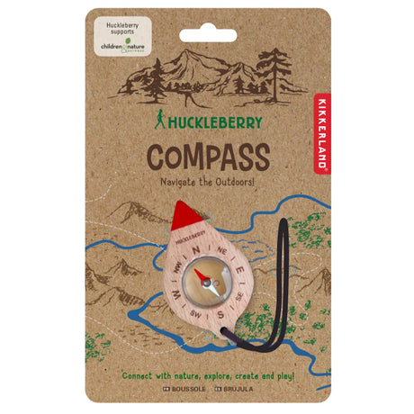 Huckleberry by Kikkerland kids wooden compass on kraft cardboard outdoor navigation toy packaging.