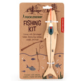 Huckleberry Fishing Kit with wooden fish-shaped holder, fishing line, bobber, and hook on a brown cardboard package.