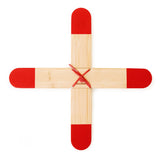 Huckleberry pocket boomerang made of four bamboo blades with red tips, secured with a red cord on a white background.