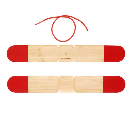 Huckleberry pocket boomerang kit featuring two bamboo sticks with red tips and a red string on a white background.