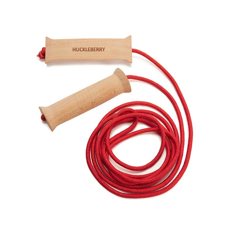 Huckleberry wooden handle skipping rope with a coiled red cord on a white background.