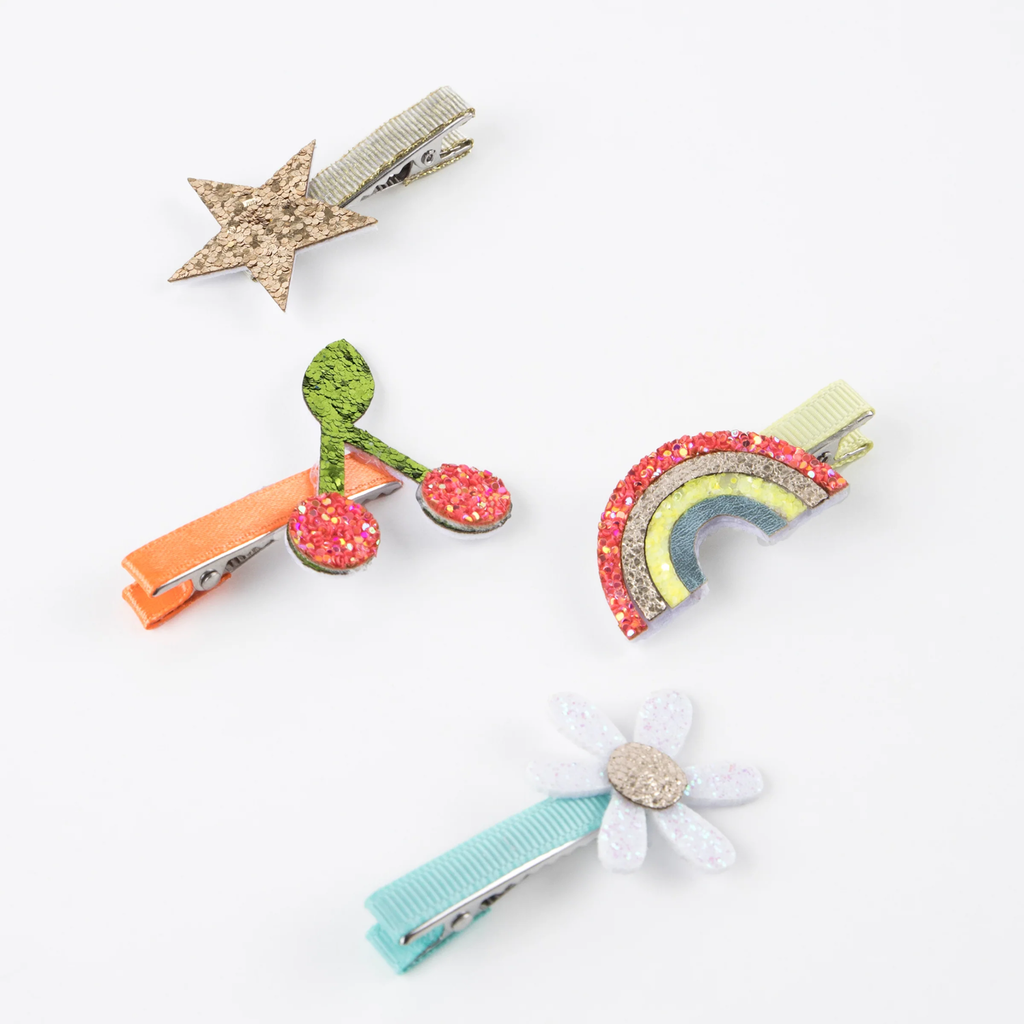 A set of fun and colorful hair clips featuring playful icon designs, perfect for adding a stylish touch to any hairstyle.