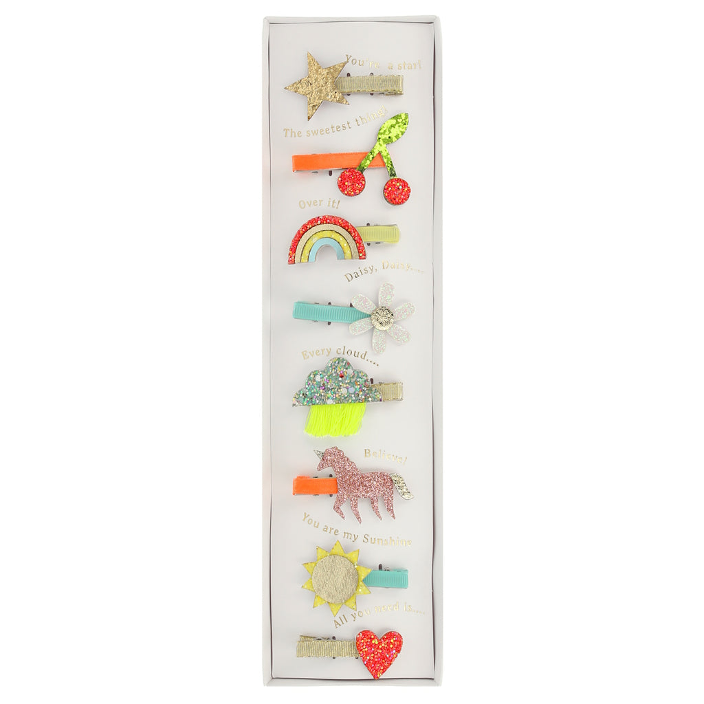A set of fun and colorful hair clips featuring playful icon designs, perfect for adding a stylish touch to any hairstyle.