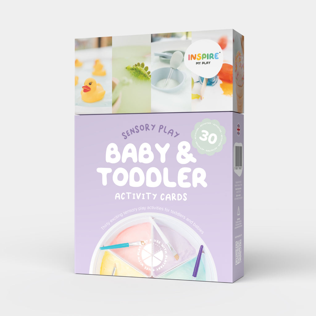 Box of "Baby & Toddler Activity Cards" for sensory play. Features playful design, pastel colors, rubber duck, paint, and crafting materials.