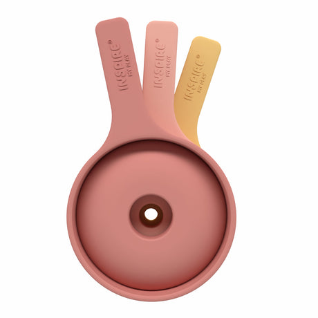 Three nested silicone funnels in pastel colors coral and yellow, stacked vertically. They convey a neat, organized kitchen accessory setup.
