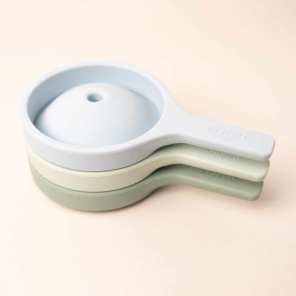 Three stackable silicone funnels in pastel blue and green, showcasing a minimalist and practical design.