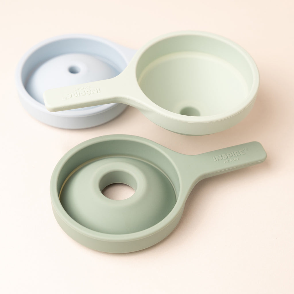Three stackable silicone funnels in pastel blue and green, showcasing a minimalist and practical design.