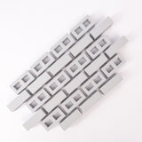 Abstract geometric pattern of interlocking gray rectangular blocks on a white background. The design is orderly and conveys a modern, minimalist aesthetic.