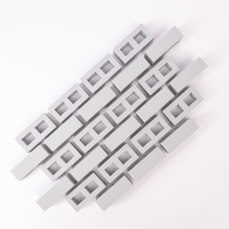 Abstract geometric pattern of interlocking gray rectangular blocks on a white background. The design is orderly and conveys a modern, minimalist aesthetic.