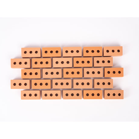 Silicone mini bricks, each brick is terracotta-colored with round holes, conveying a playful tone.
