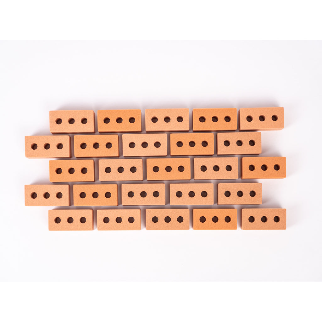 Silicone mini bricks, each brick is terracotta-colored with round holes, conveying a playful tone.