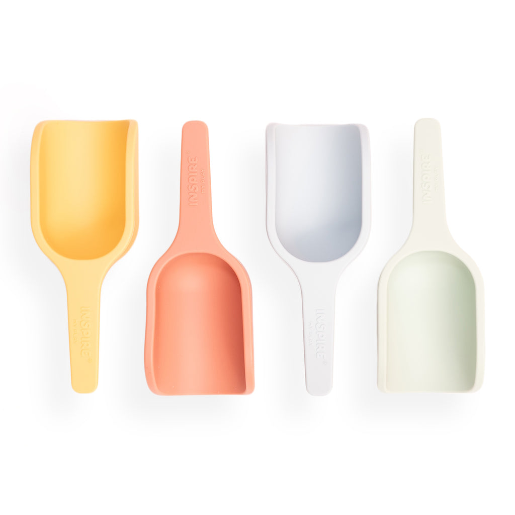 Four colorful mini scoops arranged side by side against a white background. Colors from left to right: yellow, orange, light blue, and pale green.
