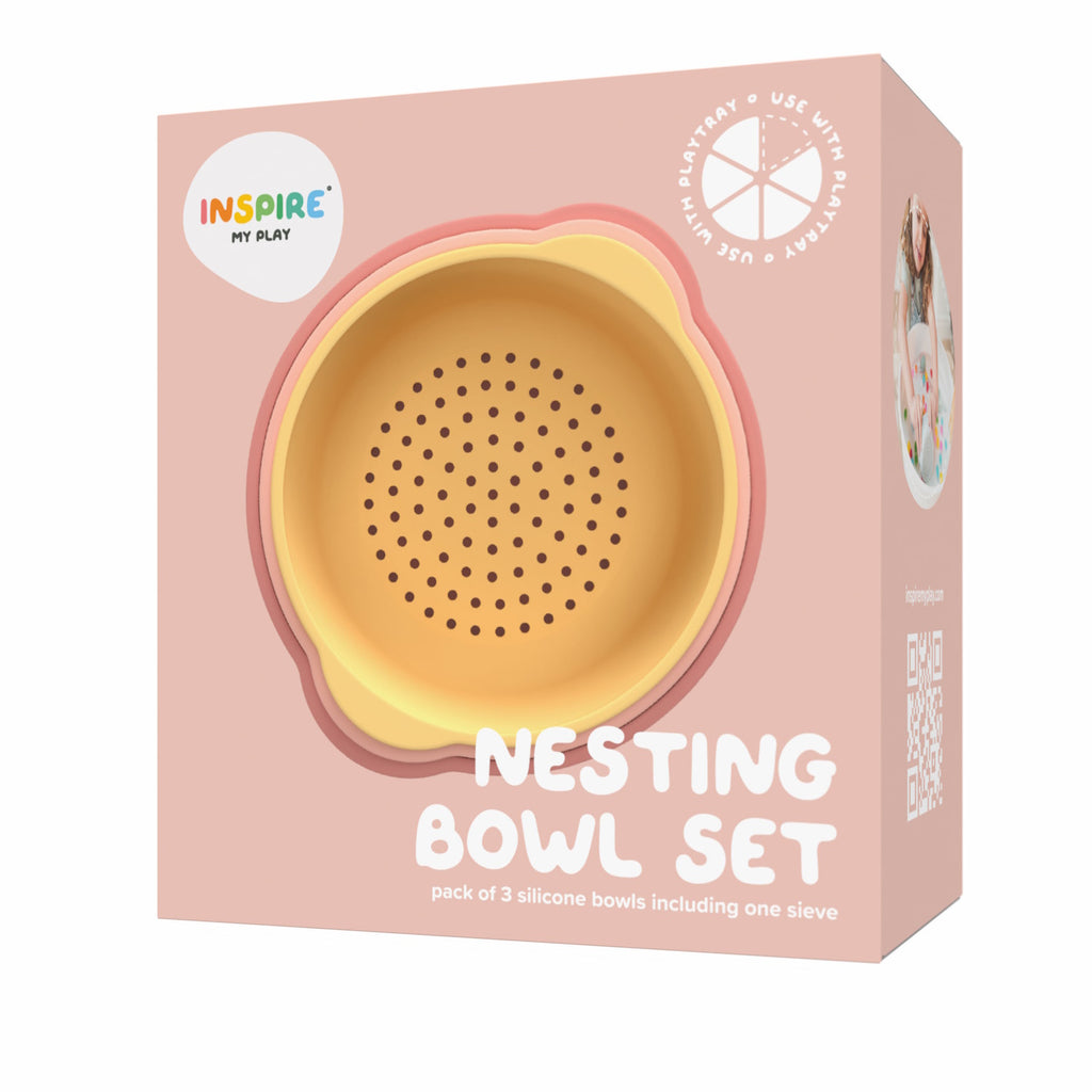 Packaging for Inspire My Play's Nesting Bowl Set, featuring a yellow and coral silicone bowl with a sieve design. Soft pink background, playful, child-friendly tone.