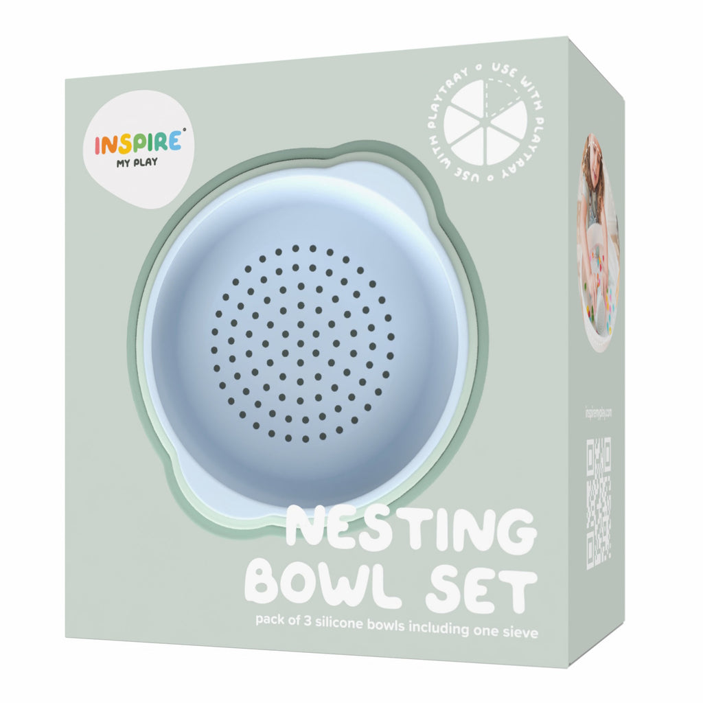 Packaging for a "Nesting Bowl Set" with a cute, pastel blue silicone sieve visible. Labeled for use with play products, the design is playful and modern.