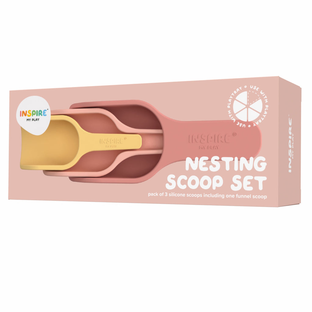 Packaging of a "Nesting Scoop Set" with three nested silicone scoops in muted pink and yellow. The box is blush pink, creating a calm, playful tone.