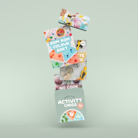 Box of "Sensory Play Activity Cards" with vibrant images of toys and colorful activities, promoting playful learning for young children.