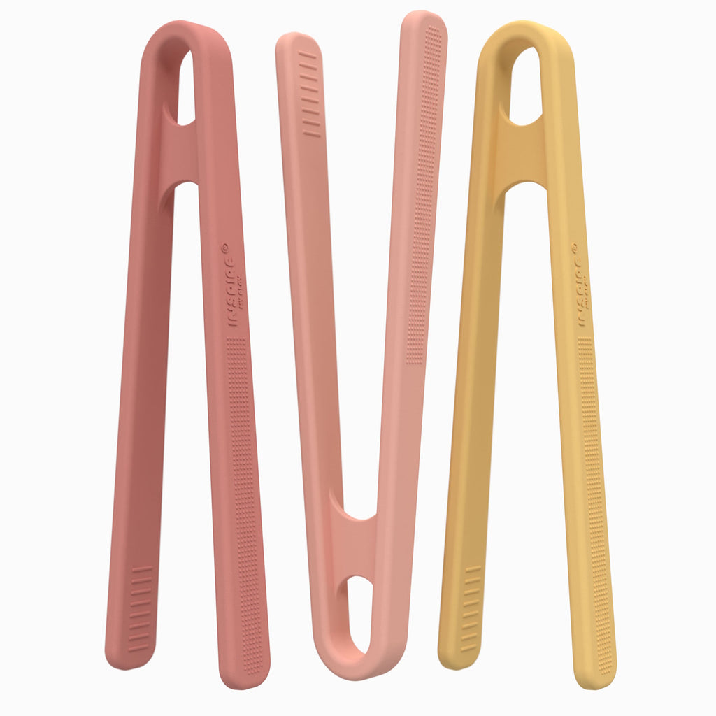 Three colorful tongs standing upright against a white background; coral and yellow pastel, with a sleek, modern design and textured grips.