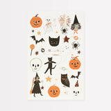 Meri Meri Halloween temporary tattoo sheet featuring pumpkins, cats, witches, and skeletons.