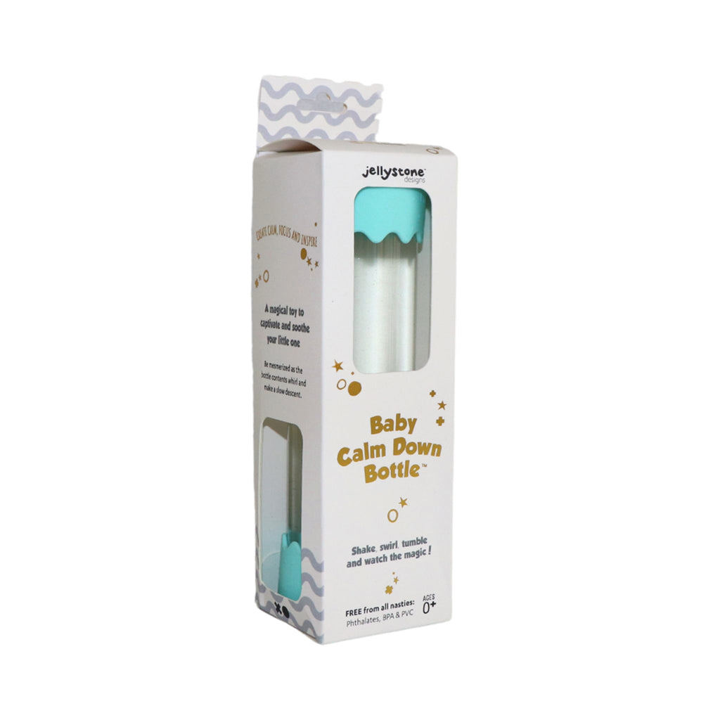 A boxed Jellystone Baby Calm Down Bottle in mint-green, with packaging describing its calming and focus-enhancing sensory benefits.