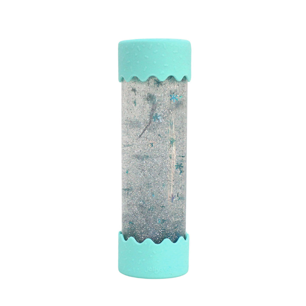 A sensory calm-down bottle with swirling silver and blue glitter, encased in a clear tube with soft mint-green silicone ends.