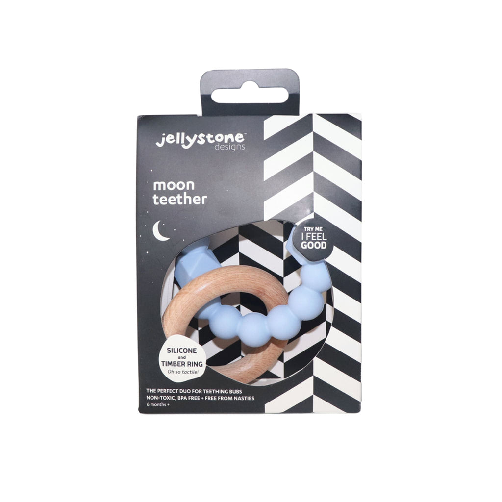 Jellystone Moon Teether - Packaged in Soft Blue
The Jellystone Moon Teether in soft blue, displayed in sleek black-and-white chevron packaging with a clear window, highlighting its tactile silicone and timber textures.