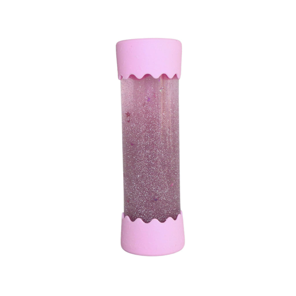 A Jellystone Baby Calm Down Bottle in bubblegum pink, filled with shimmering pink and silver glitter, standing upright with pastel pink silicone ends.
