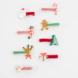 Set of velvet Christmas hair clips with festive charms including Santa, a tree, and reindeer.