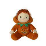 Seated plush doll in an orange jack-o'-lantern suit with its pumpkin hood pulled down.