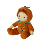 Seated plush doll in an orange jack-o'-lantern suit angled to the left against a white background.