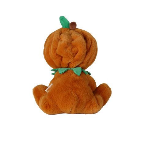 Back view of a seated plush doll in an orange pumpkin suit with a green leaf and stem on its hood.