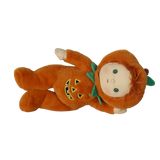Plush doll in an orange jack-o'-lantern suit lying down sideways against a white background.