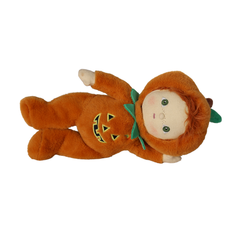 Plush doll in an orange jack-o'-lantern suit lying down sideways against a white background.