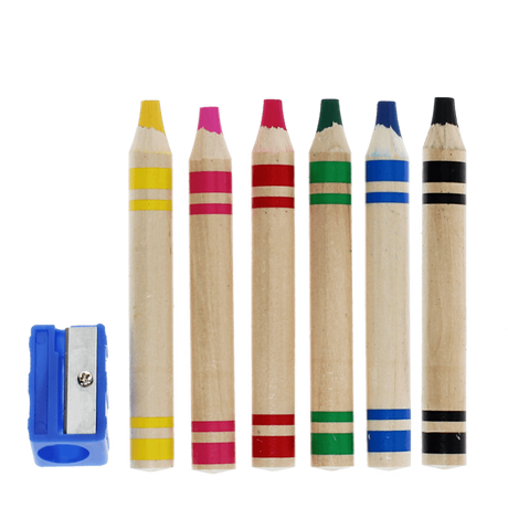 Six colorful jumbo wooden crayons lined up next to a blue sharpener.