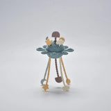 Blue silicone baby pull toy with hanging shapes shown standing in a front view.