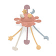 Coral silicone baby pull toy with multi-textured hanging shapes shown at an angle.