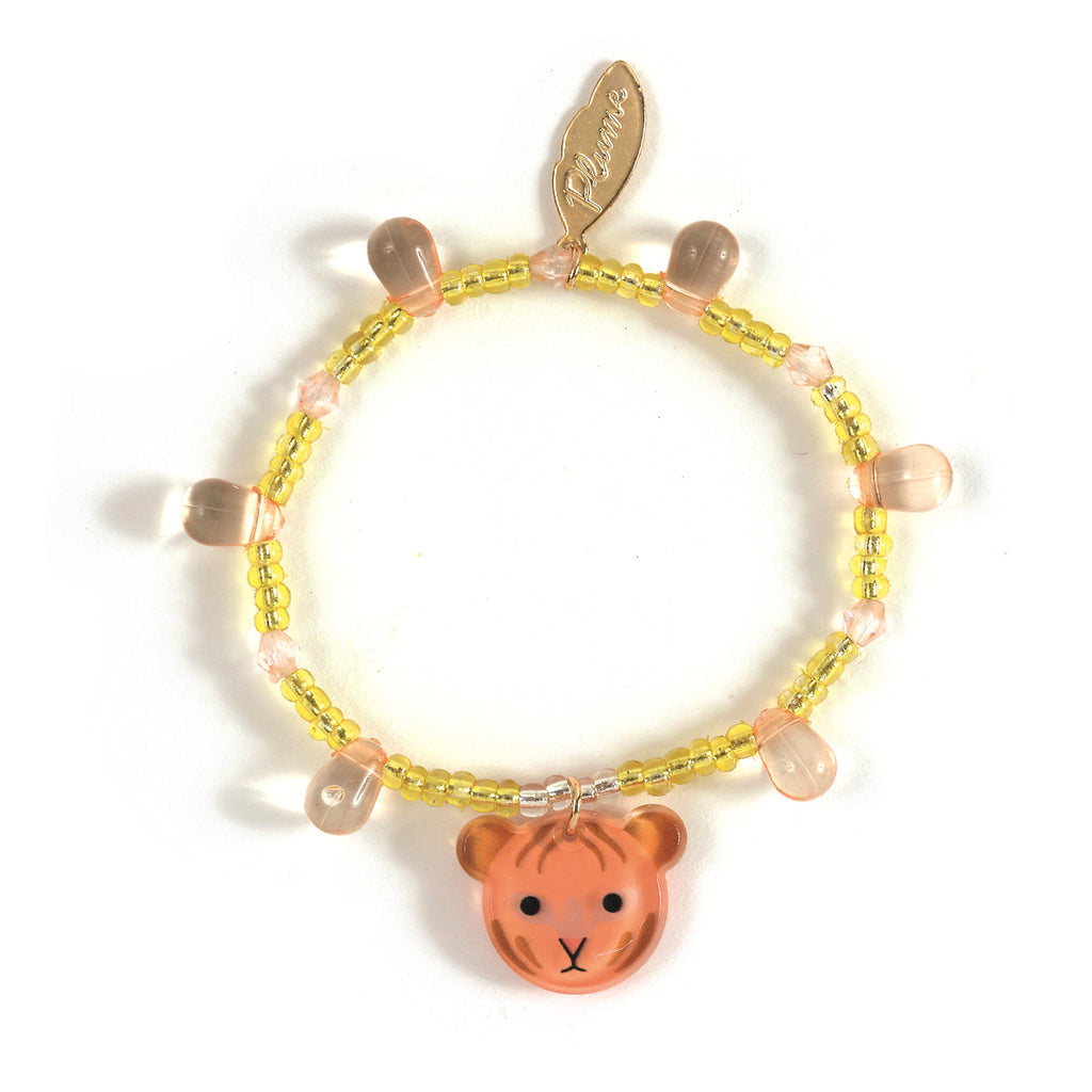 Beaded bracelet with yellow beads, orange teddy bear charm, teardrop-shaped pink beads, and gold leaf tag. Whimsical, playful design.
