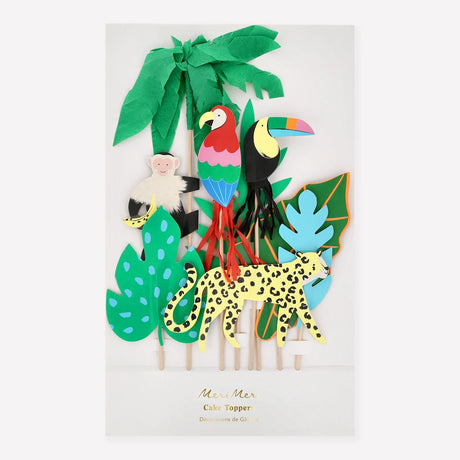 A set of jungle-themed cake toppers featuring a monkey, parrot, toucan, leopard, and tropical leaves on sticks.
