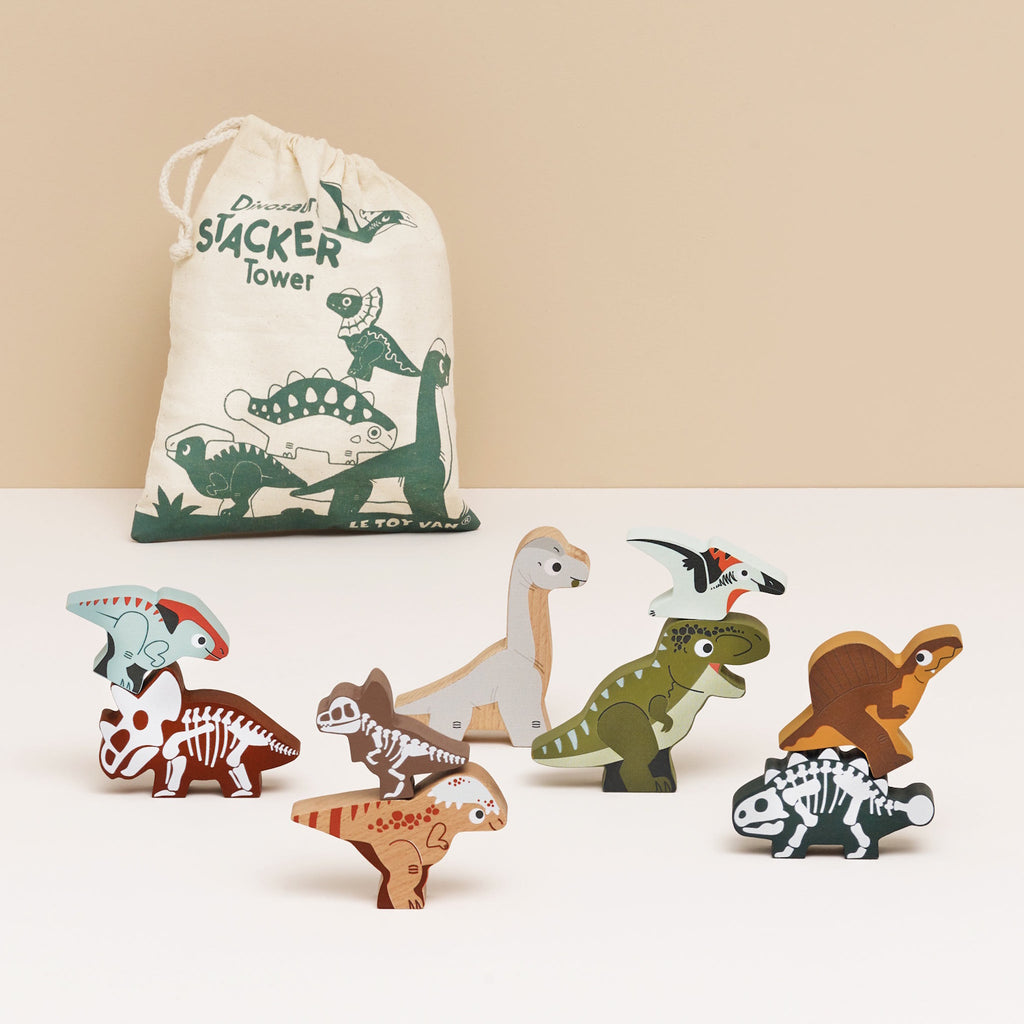 Cloth bag labeled "Dinosaurs Stacker Tower" with colorful wooden dinosaur figurines, featuring playful expressions and varied patterns, evoking fun and creativity.