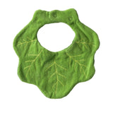 Green kale-shaped baby bib with yellow stitched leaf veins, featuring a scalloped edge and snap closure.