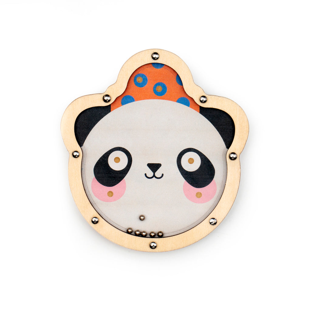 Cute panda face in a wooden frame with a playful expression. Background features orange with blue polka dots. Small metal balls are inside.