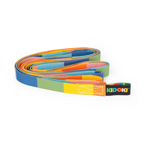 Colorful woven strap with sections of blue, green, yellow, orange, and pink, branded "KIDOKI" on a black loop. Playful and vibrant design.