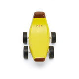 Whimsical yellow banana-shaped toy car with a smiling face, brown tips, and four wheels. It exudes a playful and cheerful vibe.