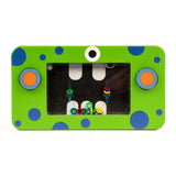 Bright green rectangular toy with blue polka dots and two gear-shaped knobs, featuring a black screen with colorful rings and a whimsical eye design.