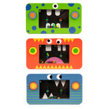 Three colorful rectangular toys arranged vertically, each with a monster face design. From top to bottom: green with blue dots, orange with zigzag teeth, and blue with stripes.