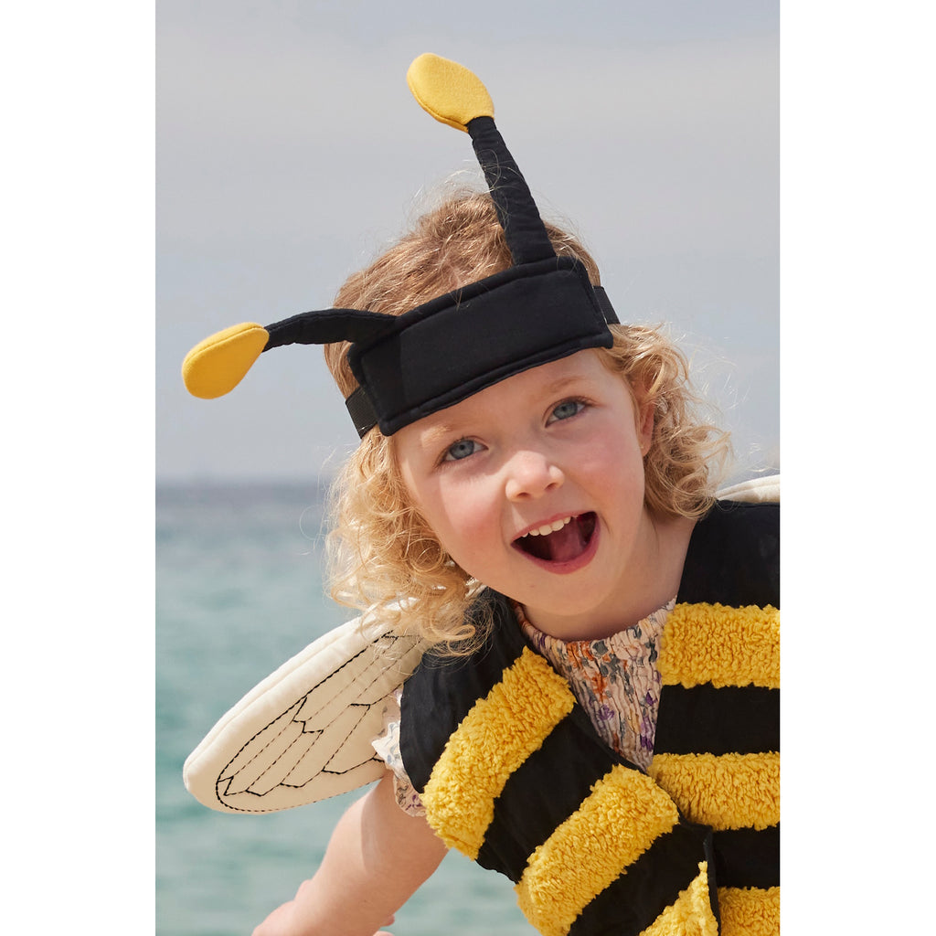 A playful bee costume for pets featuring yellow and black stripes, translucent wings with vein details, and a black headband with yellow pom antennas.